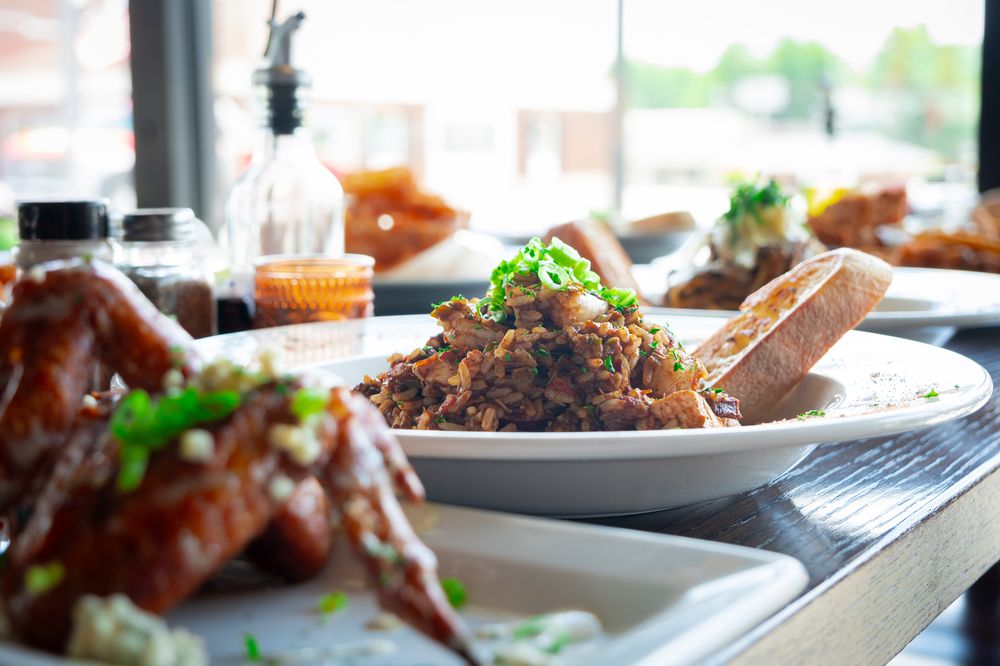 Creole jambalaya with grilled bread, tableside by the window