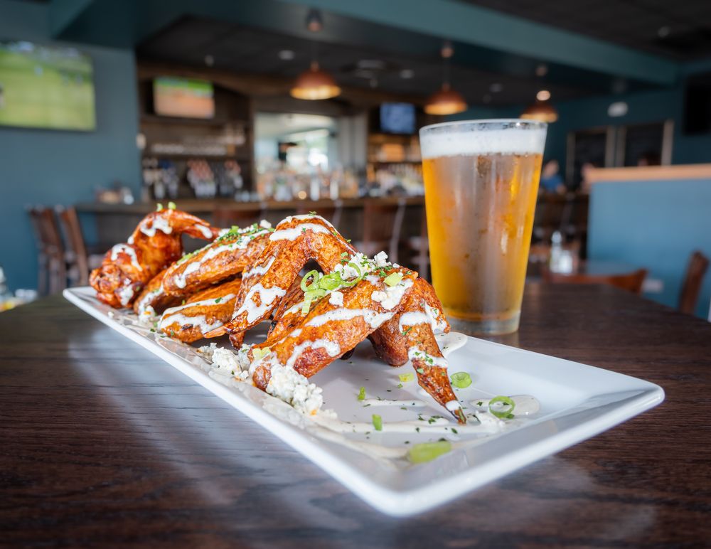 Jaybird wings tossed in buffalo or BBQ sauce with bleu cheese crumbles